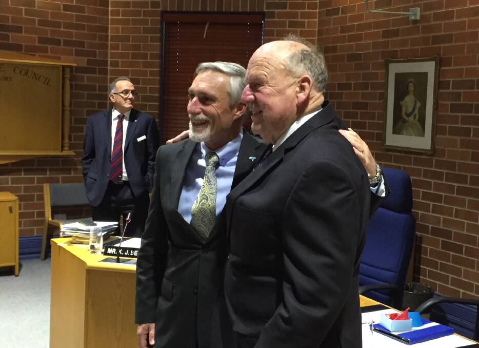 Mayor Paul Harmon and former mayor Barry Johnston pose for a quick photo after Wednesday afternoon's council meeting.