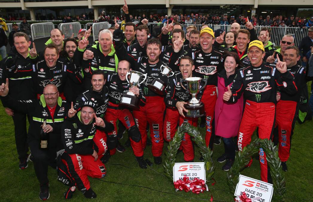 YOU BEAUTY: Members of the Holden Racing Team celebrate winning the Sandown 500. Photo: GETTY IMAGES