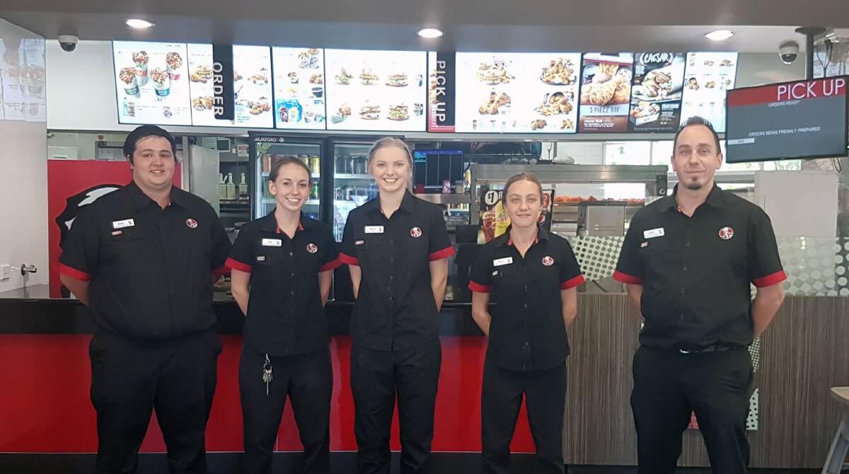 ON THE FRONTLINE: Justin Owen and his management team at KFC Inverell. The store is sponsoring and supporting a number of local groups and clubs in Inverell and surrounds. They will soon launch the KFC Xpress app.