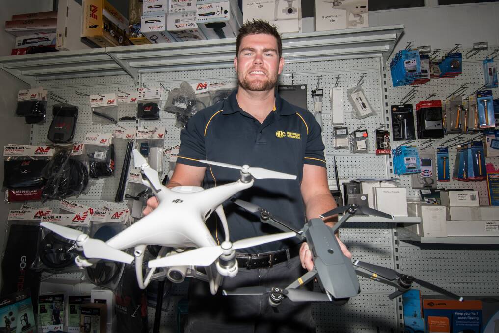 Rising technology: Jason Simmons shows off some of the newer models of drones that farmers have been buying up as the technology grows faster than mobile phones, sweeping the industry. Photo: Peter Hardin
