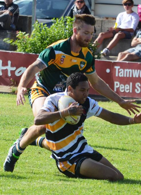 Harold Duncan (ball) scored two tries in the Hawks win over Macintyre.