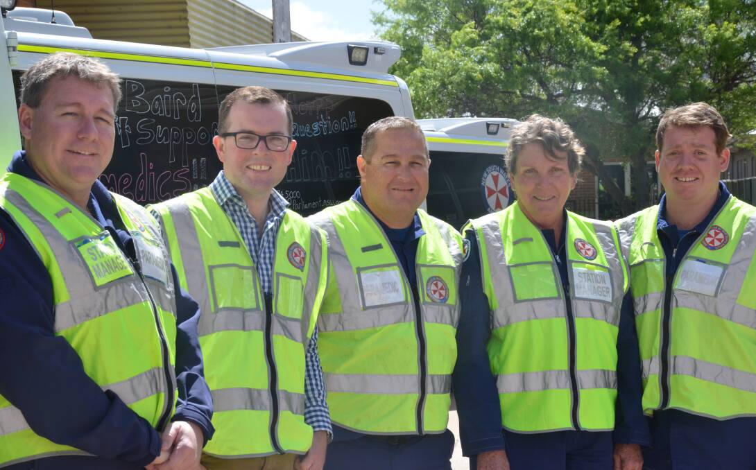 Lights and sirens: Northern Tablelands MP Adam Marshall joins the team (from left) Brad Tindall, Clint McSpedden, Sue Baker and Scott Freestone at the Inverell Ambulance station to better understand their role.