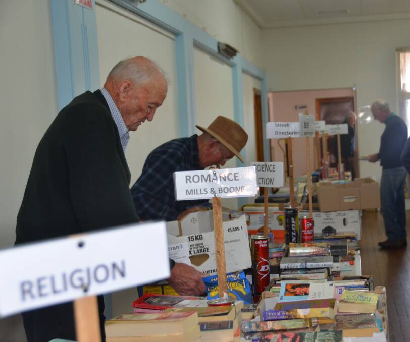 BOOK LOVERS DREAM: Inverell Rotary members sort through thousands of books at the Masonic Hall in preparation for their annual book sale which kicks-off on Saturday.