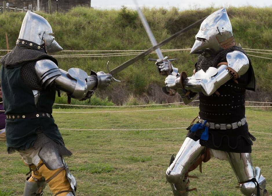 DARK AGES: Phillip Timms and Wolfgang von Herman of the Companie Draco Routiers duel it out with broadswords at the festival two years ago.