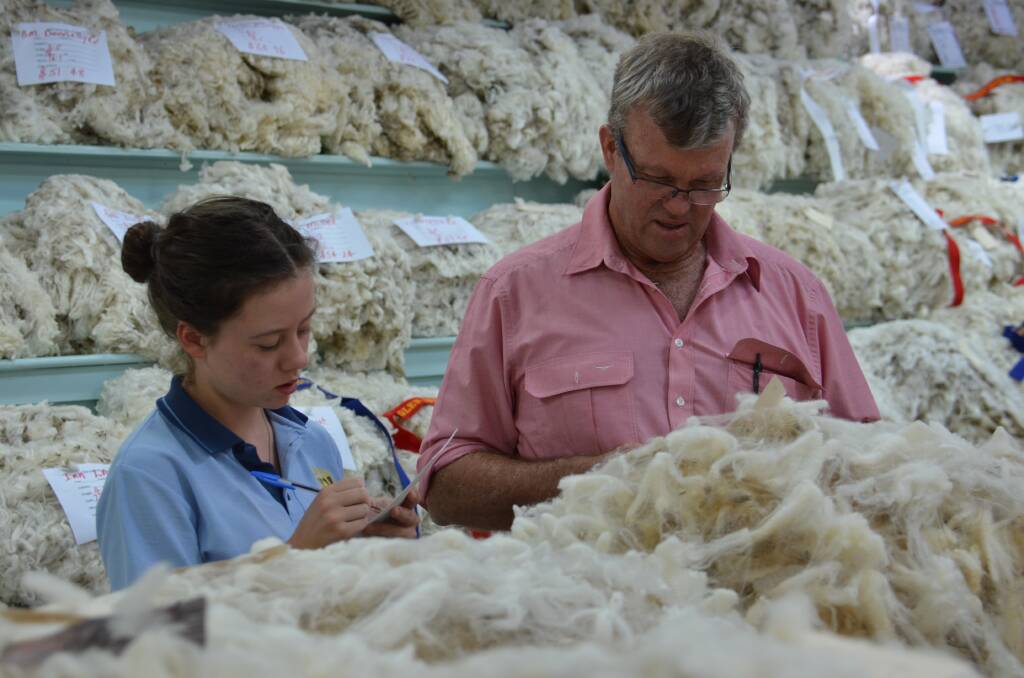 ON SHOW: Wool section judge Peter Sealy from Elders with student Heidi McCormick.
