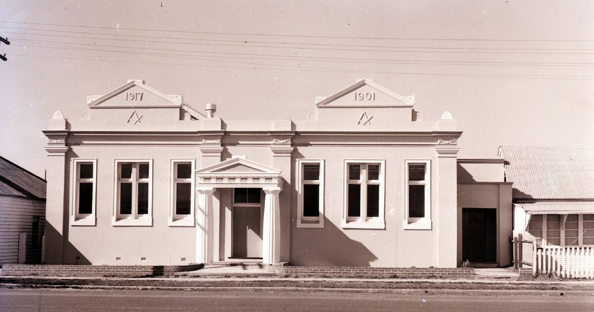 1961: The graceful white Masonic Lodge, bearing the symbols of compass and square and fronted with a porch supported by two columns, has been used for many events.