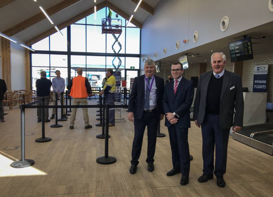 Armidale Regional Council chief executive Peter Dennis, Northern Tablelands MP Adam Marshall, and Council's administrator Ian Tiley in the new Armidale Regional Airport check-in terminal.