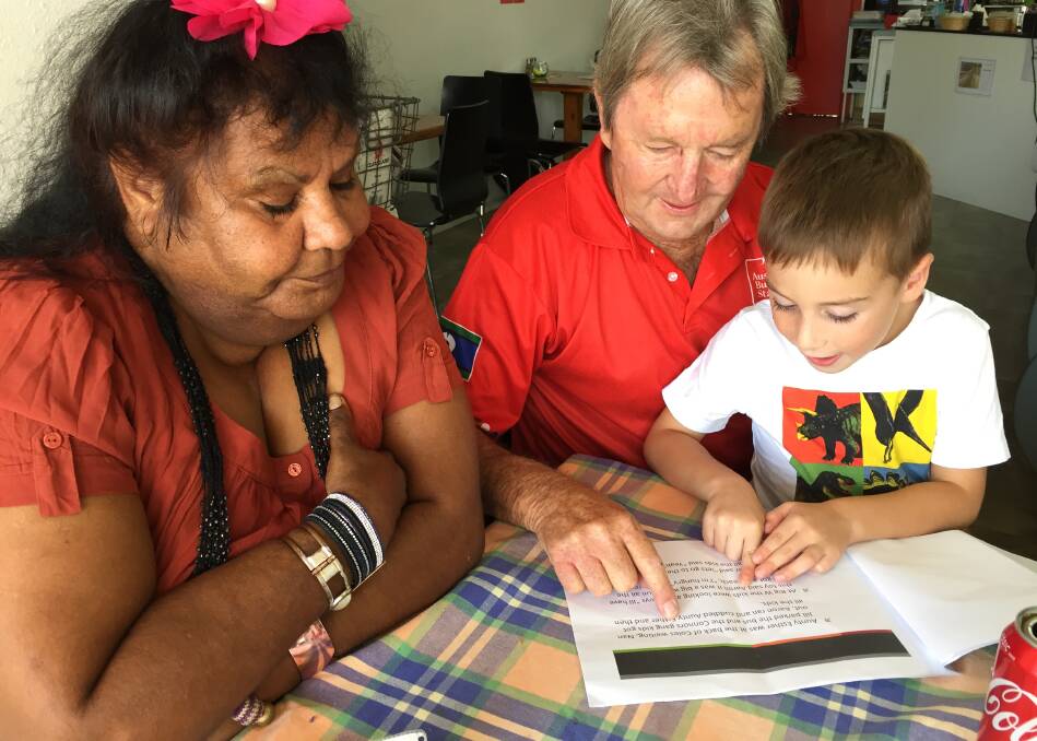 SHARING: Esther Gardiner with Paul King and his grandson Sam read through one of Esther's stories. 