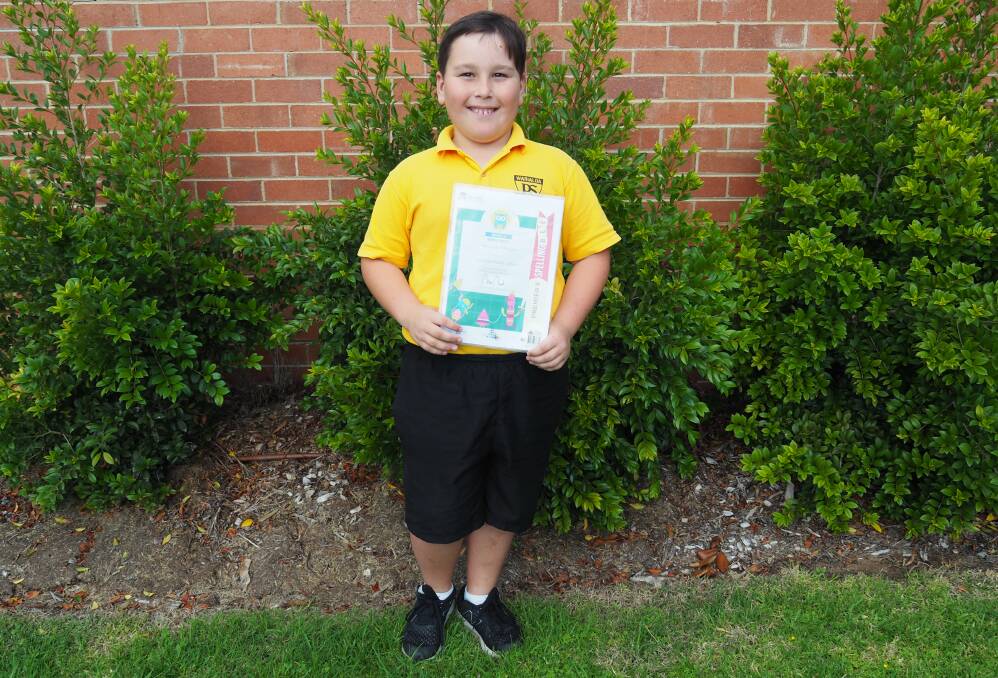 Christian Whalan with his certificate from the regional spelling bee. Photo contributed by Warialda Public School