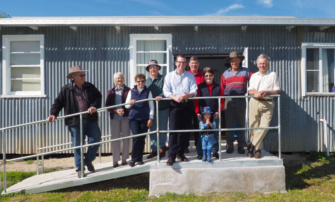 Myall Creek Public Hall and Recreation Reserve Trust members Warren Rogers, left, Joyce Partridge, Wendy Hasselmann, Jeff Foster, young Zachary Read, Diane Read, Graeme Newnham and Mike Partridge with Adam Marshall at the Myall Creek Community Hall.