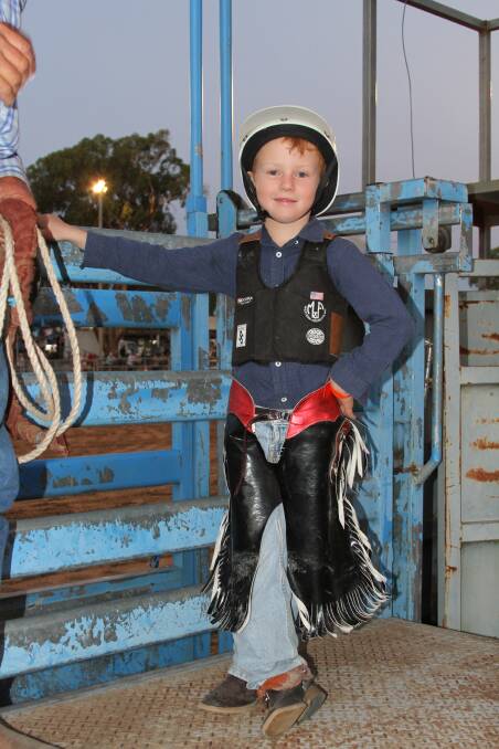 Local competitor Darcy Oakes 6 years old making his steer riding debut at Inverell. Photo by Jodie Adams Photography