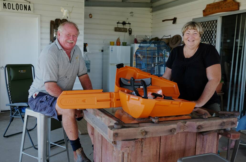 BLOWN AWAY: Rod Kent and Tammy Taylor with the chainsaw donated by Inverell's Motor Mecca to auction off in support of Logan Taylor.