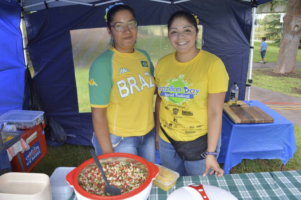 CELEBRATION: Thamires and Fernanda serving up the flavours of Brazil during the 2016 Inverell Multicultural Festival. Photo: Harold Konz