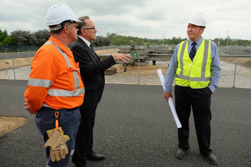 NEW WORKS: Eire site engineer Mark Williamson with Inverell council deputy mayor Anthony Michaels and environmental engineer Michael Bryant beside one of the existing aeration tanks. Photo: Michèle Jedlicka