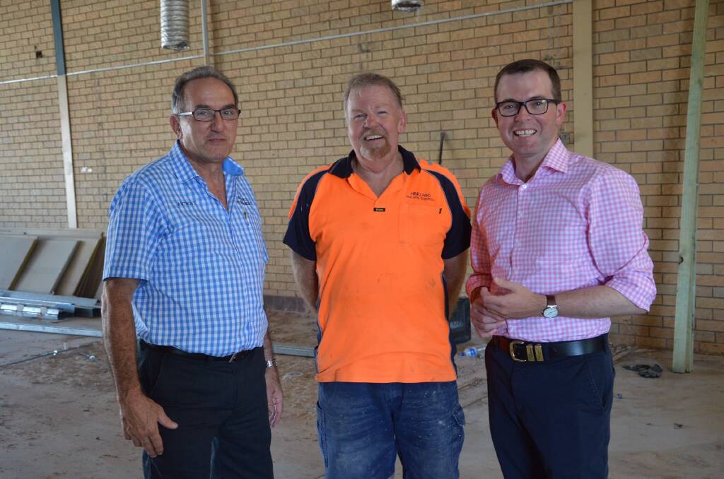 Northern Tablelands MP Adam Marshall, right, discusses progress on the new Inverell Service NSW Centre construction with Inverell Shire Deputy Mayor Anthony Michael, left, and site supervisor Noel Harland, at the 240 Byron Street building.