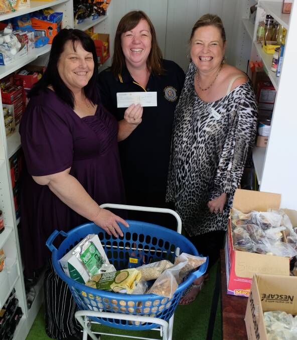 STOCKING UP: Life Foundations' Leonie Pearce, Inverell CWA's Coral Knight and pantry volunteer and CWA member Lynda Atkinson with the presented cheque.