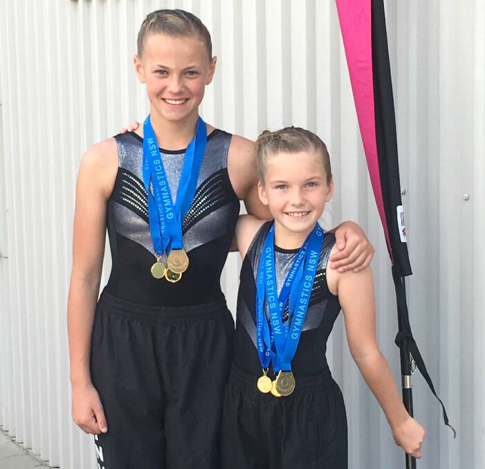 TOPS:  Sophie Kastelein and Elizabeth King performed well at Newcastle with a few gold medals to show for it. Photo supplied by Amanda Woodbury.