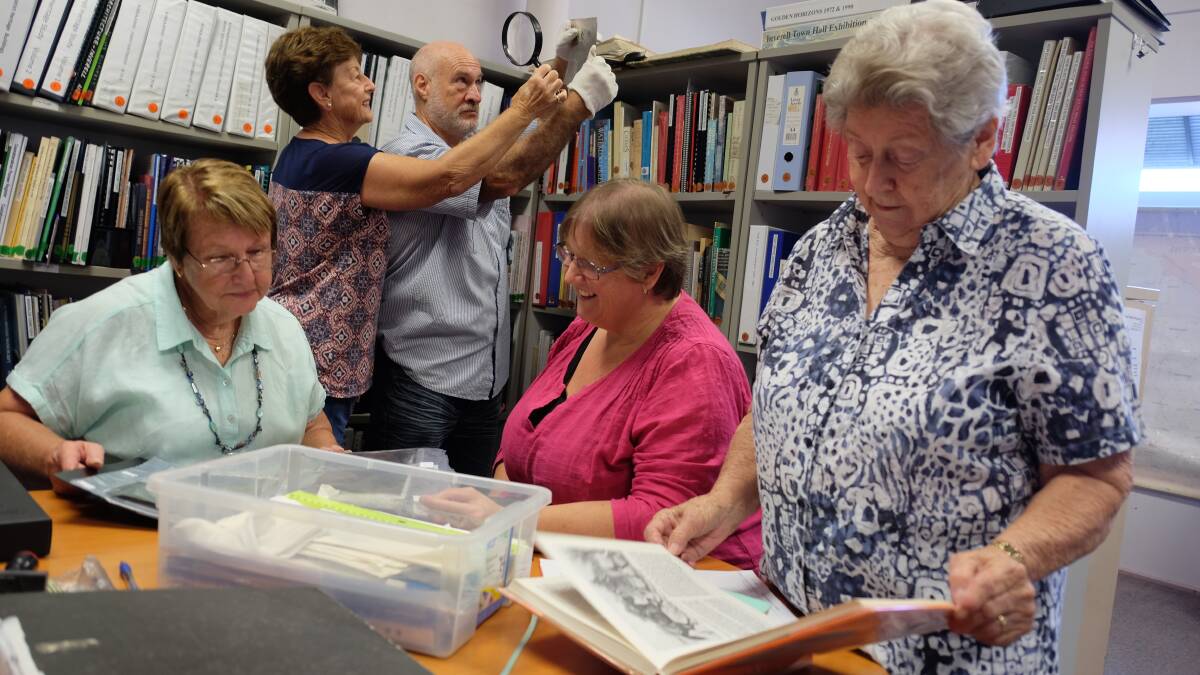 RESEARCH: Family History Group members Gloria Baldwin, Lorraine Watson, Ken McLeod, Kathy McLeod and Muriel Resta delving into some of Inverell's history in their current space. 