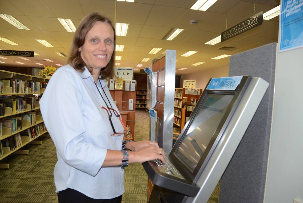 YOUR SAY: Inverell Public Library services officer Helen Elliot with the kiosk at the library where people can lodge their survey. Photo: Naomi Shumack