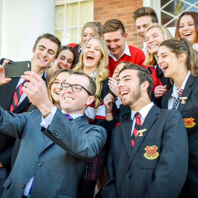 Member for Northern Tablelands Adam Marshall with a cluster of Inverell High School students, taking a selfie. Photo by Simon McCarthy