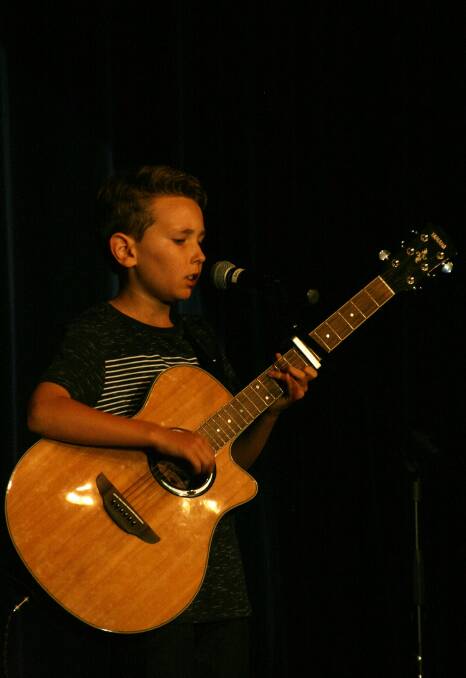 YOUNG TALENT: Geoff McCosker, the youth award winner performing and singing I See Fire. Photo by Dick Hudson