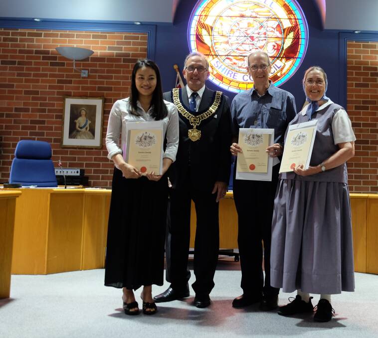 PROUD: New citizens Eva Sangsrigaew and Bill and Grace Wiser with deputy mayor Anthony Michael. 