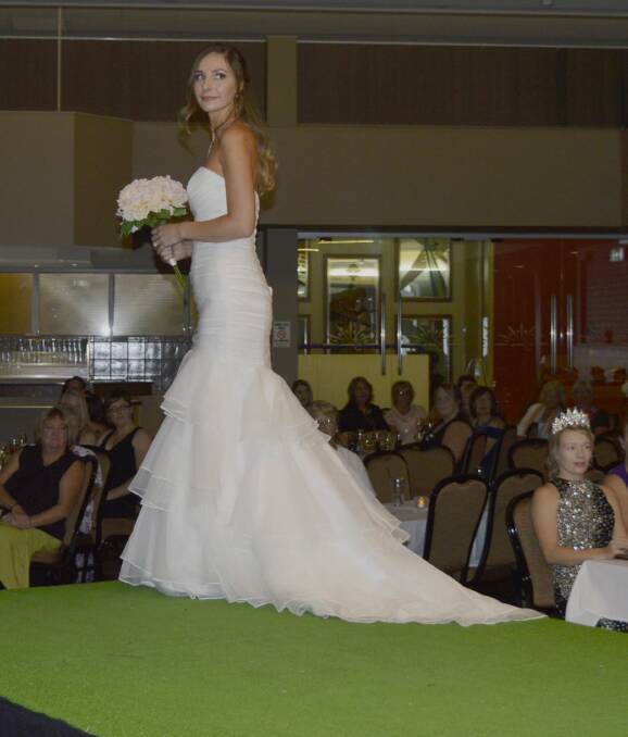 EYE-CATCHING: Tiarne Hurford on the catwalk in her original bridal gown at the RSM Club. Photo: Harold Konz