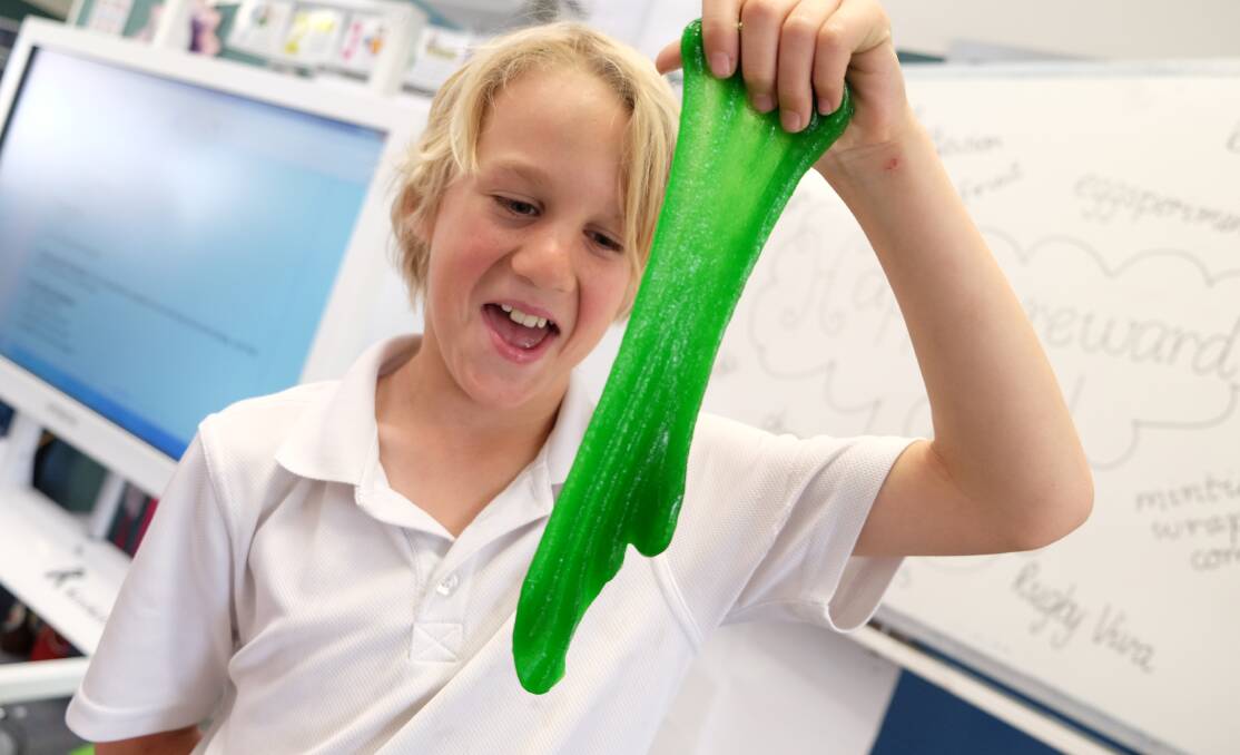 Riley Beeton with some of the slime the class made.