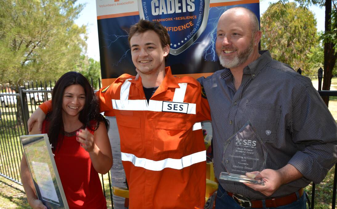Becoming a well-respected member of Inverell SES: Andrew Street with mum Julie Walton and dad Adam Street after the official photos were taken. Photo: Merilyn Vale.