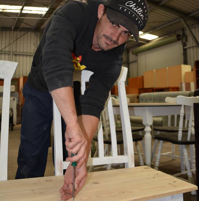 Giving back from the Revolving Shed: Jai Squires says he enoys working on bringing new life to donated furniture before sending it out again for a second go. Photos: Merilyn Vale