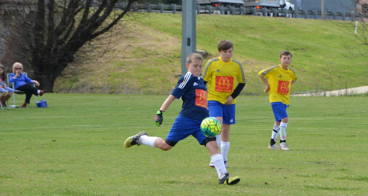 Under 11 France V Brazil: Inverell goalie Sam Hilton gets one away with support from team mates in the game against Toowoomba Grammar.