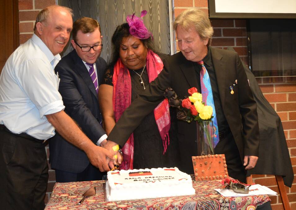 Cutting the cake: Esther Gardiner with Senator Waka Williams, Mr Marshall and Cr King.