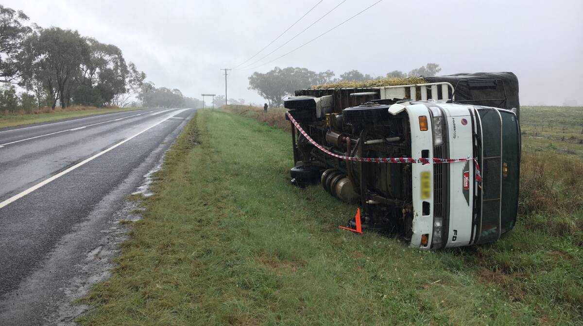 Rollover: A small truck tipped on Delungra Rd when the driver attempted to fix a flat tyre. Photo: Heidi Gibson