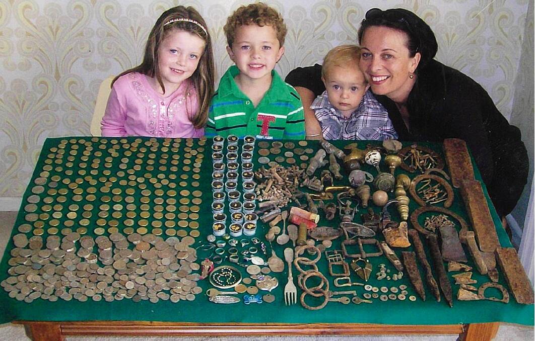 Brian Martin's grandchildren, twins Chelsea and Lachlan, Baby Lucas and daughter Kate, along with coins, gold, jewellery and relics collected during the 6,900 km trip. 