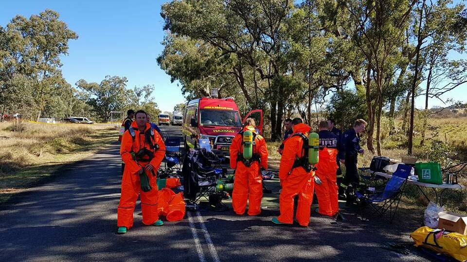 Chemical spill: A number of local fire crews helped with the Killarney Gap Rd clean-up, with some firies spending a long Saturday in protective spillage suits. 