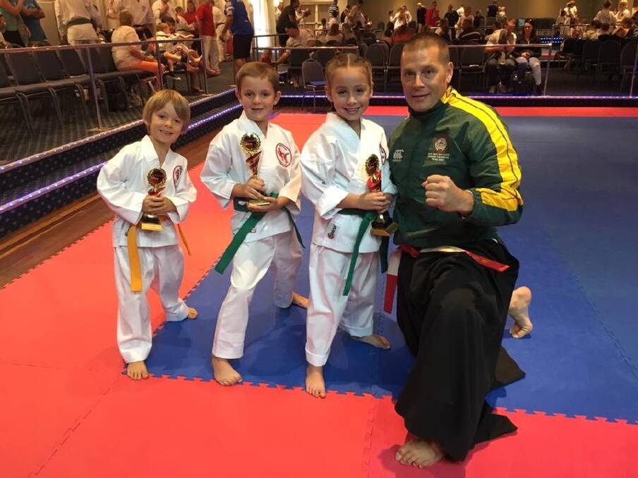 Lincoln Partridge, Dainan Swadling and Anya King with chief instructor Nick King.