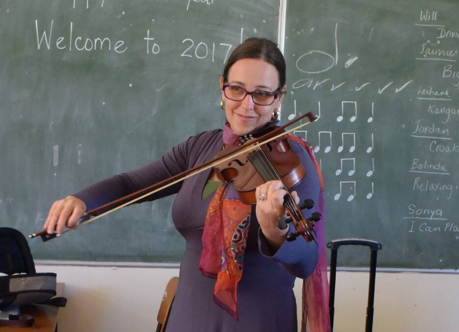 Joyful: Maria Ryan learned to love the violin over the years and is now keen to share her skill with others. 