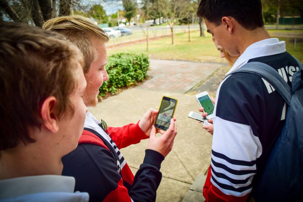 SOCIAL GAME: Inverell High School computer science students Harry Jorgensen, Jack Staader, Sophie Myhill and Jack Roussos found Pokemon in the staff common room while speaking with the Times this week, and said they had met players they may never have interacted with while playing Pokemon Go.