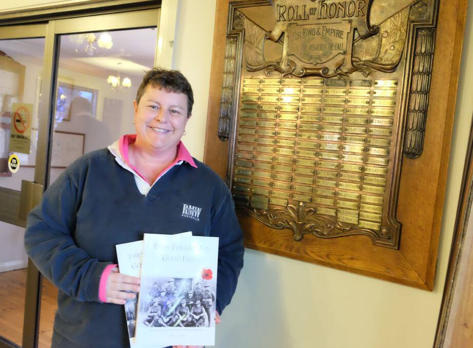 Author Donna Smith beside the Delungra honour roll.