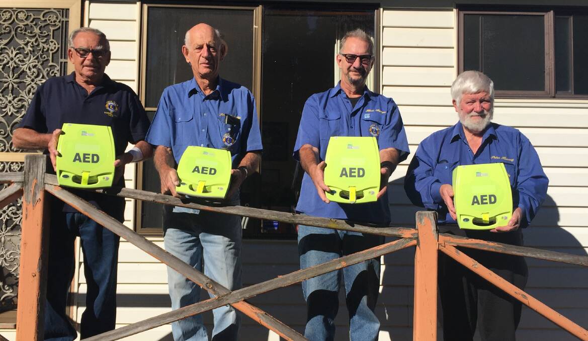 Life savers: Inverell Lions members Ross Morris, John McGufficke, Rick Lange and Peter Kearsey with some of the newly arrived machines. AEDs are also in place in local supermarkets thanks to the Macintyre Lions.