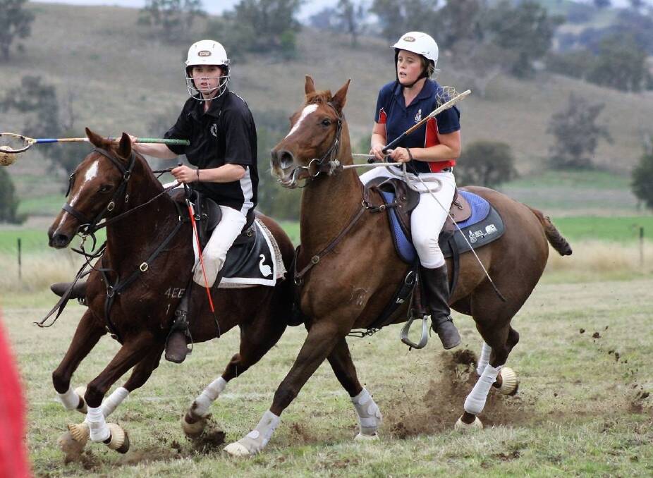 STEADY: Inverell polocrosse team player Lachie Brennan (left) has the ball and tires to outride and aim against the opposition at Narrabri.  Photo contributed.