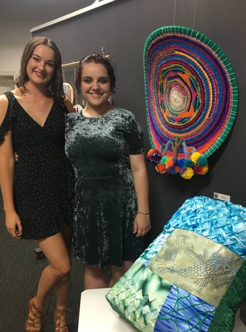 Chloe Jakins and Hayley Duffy were proud to show off their textile pieces. 