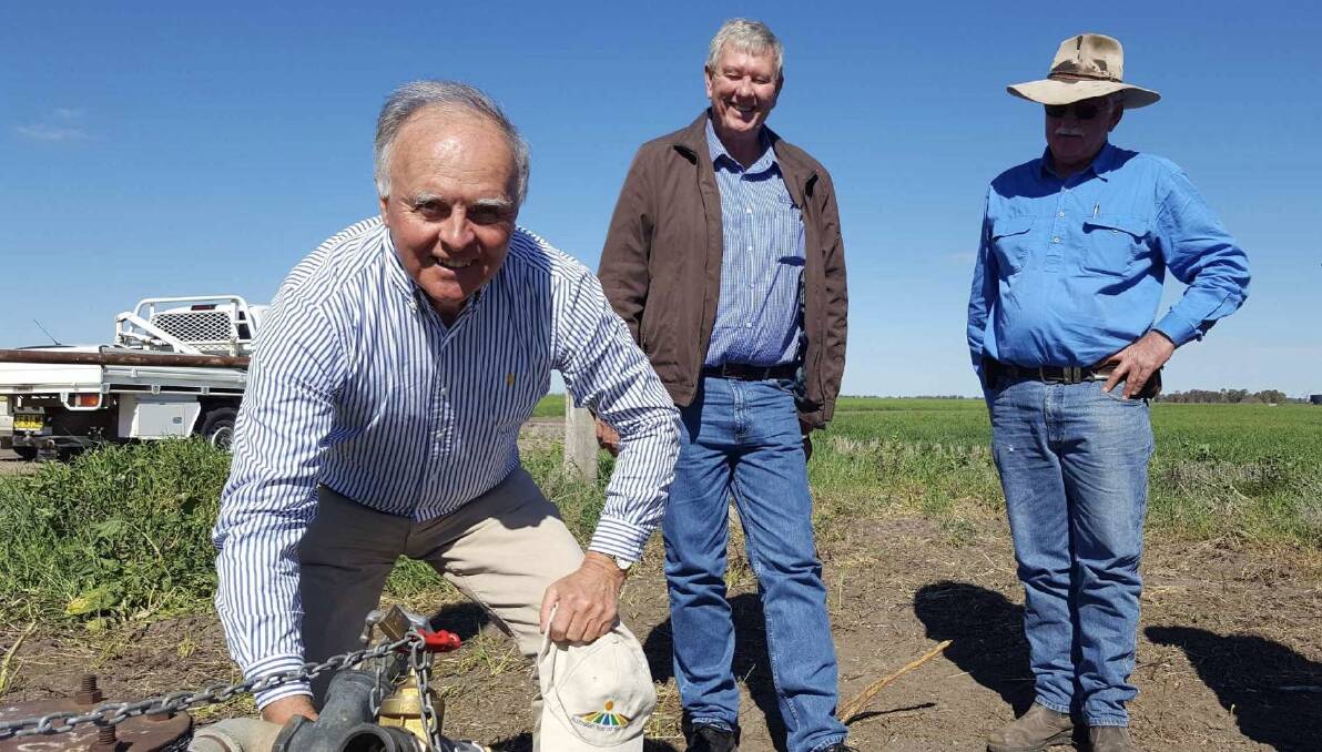 Richard Bull inspects a TSR water point with North West LLS Chair Conrad Bolton and board member Geoff Cruickshank.