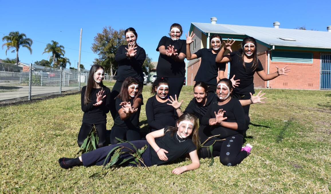 Traditional: The Dhinawan Yuliji dancers performed during Ross Hill's NAIDOC assembly.