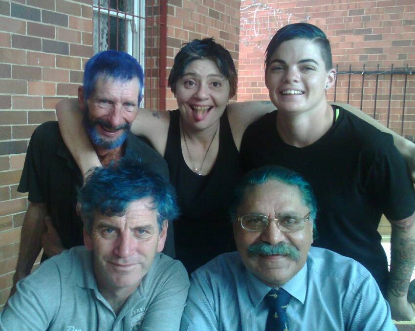 Philip Cooke, Cara Longbottom and Letitia Hartley with (front) Donald Carruthers and Kelvin Brown dyed their hair blue for the cause.