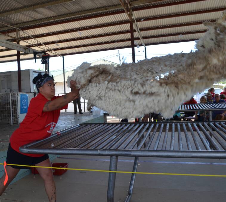 Perfect toss: Medina Hepi, of Victoria, halfway through her heat for the senior wool handling.