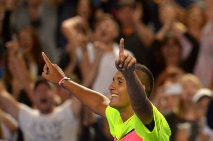 The battle is won: Nick Kyrgios shows his elation after his five-set win over Andreas Seppi. Photo: Joe Armao