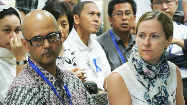 Neil Bantleman (front), with  wife Tracy, at the Jakarta International School on the day he was taken into police custody. Photo: Michael Bachelard