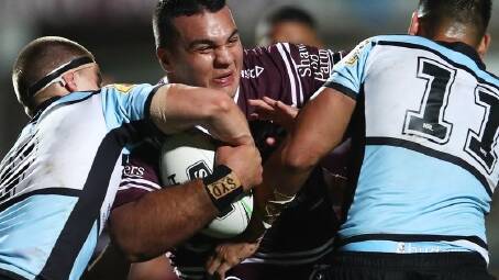 Former Manly player Lloyd Perrett (c) is threatening to take the club to the Supreme Court. (Brendon Thorne/AAP PHOTOS)