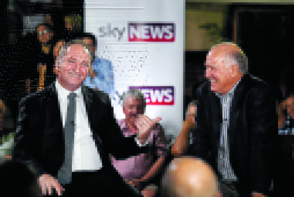 Barnaby Joyce and Tony Windsor duke it out on live television at the Tamworth Hotel. Photo: Gareth Gardner 